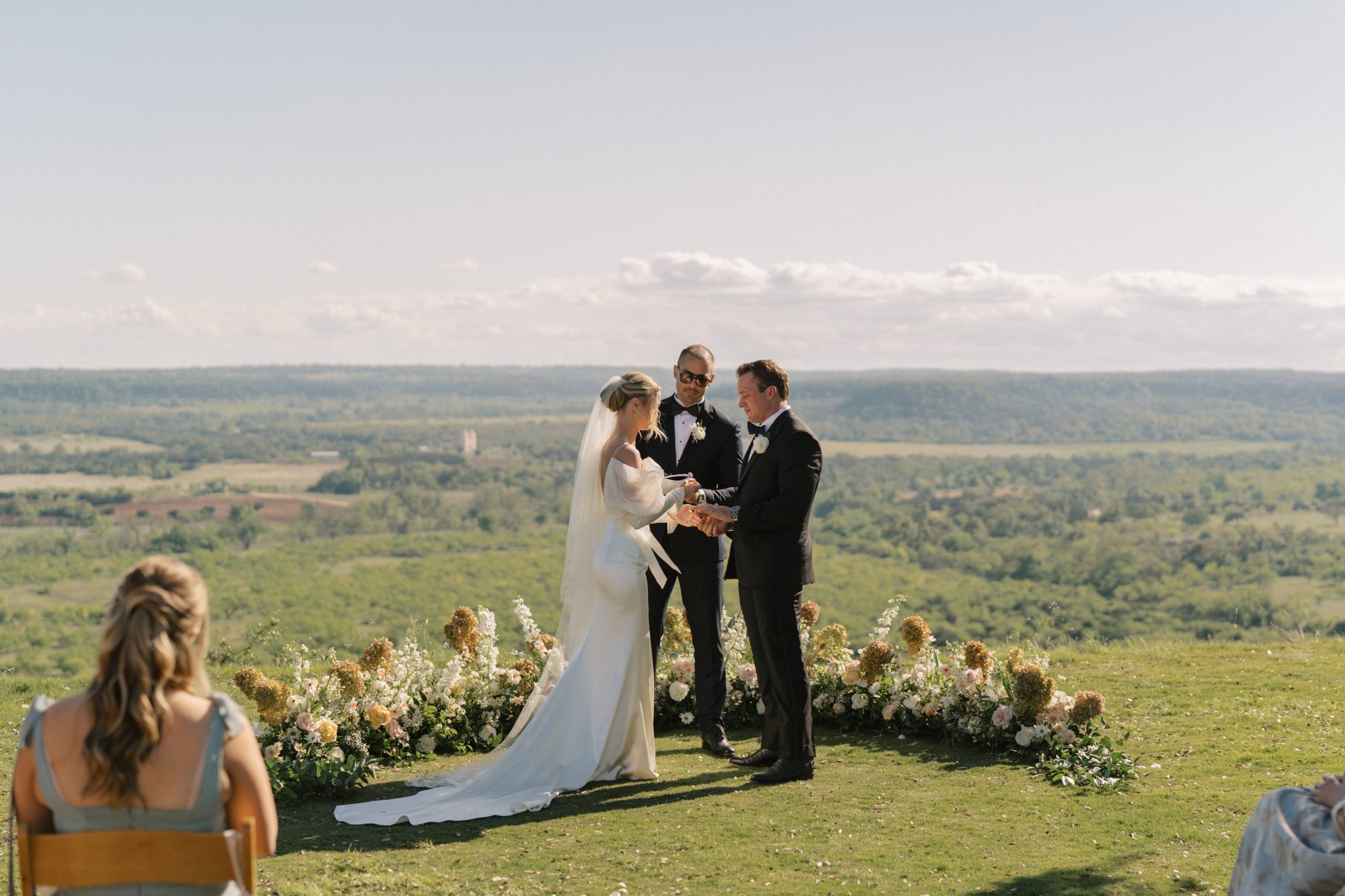 Bride and Groom saying 'I do" at Hill Country Wedding at Contigo Ranch on the bluff