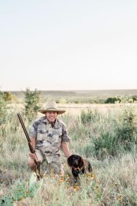 A guest and their dog explore the ranch and enjoy trap shooting on the Bluff.