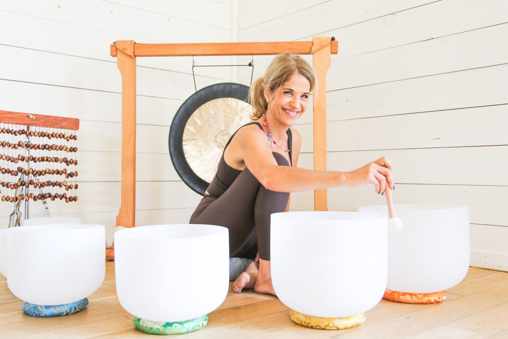 Yoga and Wellness Instructor, Melinda Kirchoff, leads a sound bath at Contigo Ranch for a group retreat.